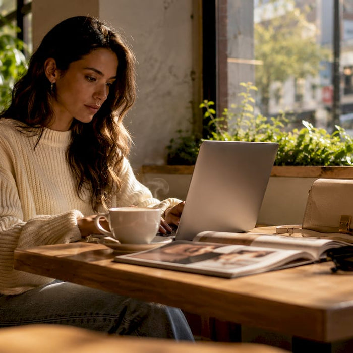 Woman browsing designer clothing online marketplaces