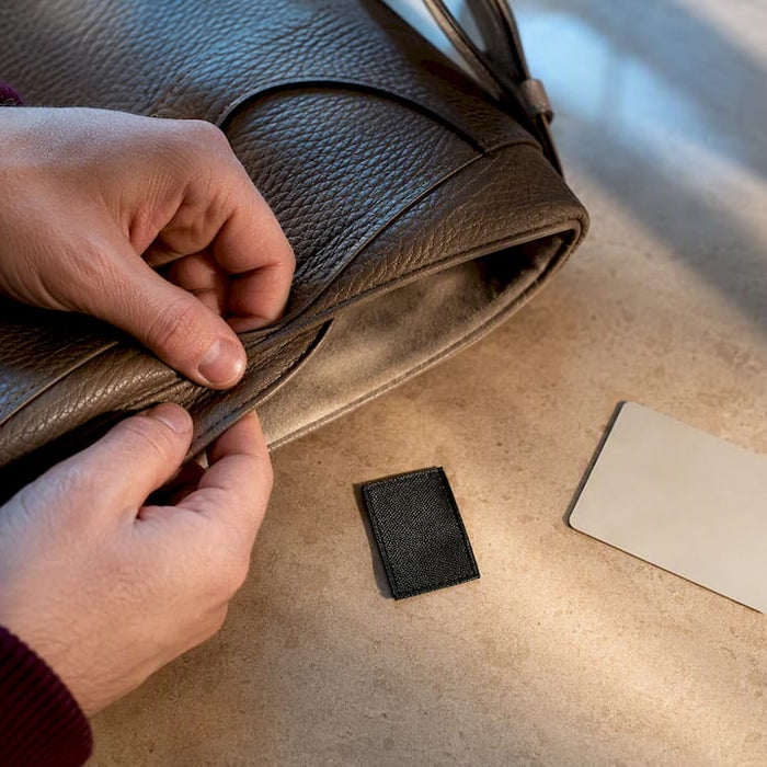 Inspecting anonymous luxury bag authenticity details