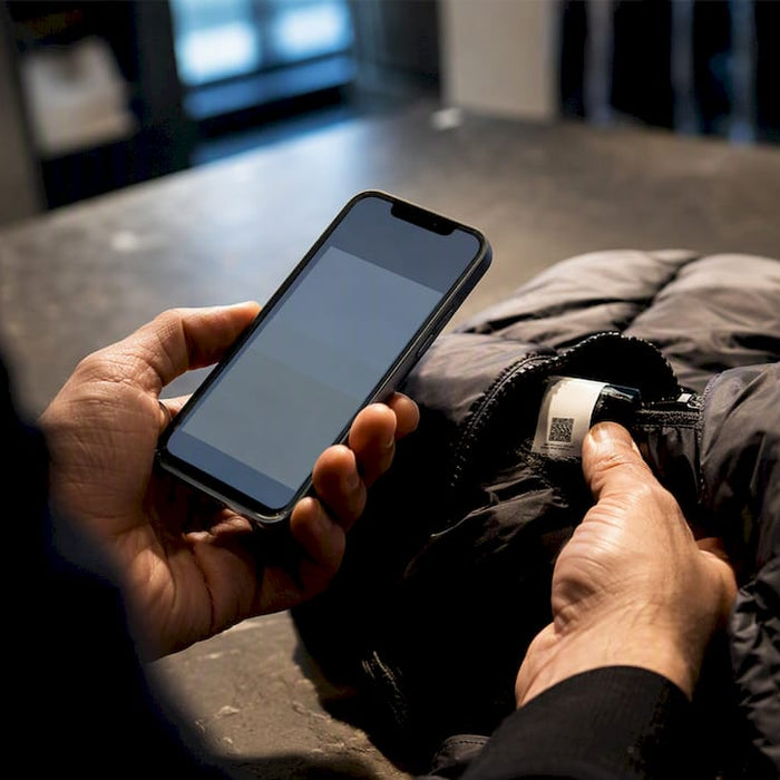 Buyer checking garment security code