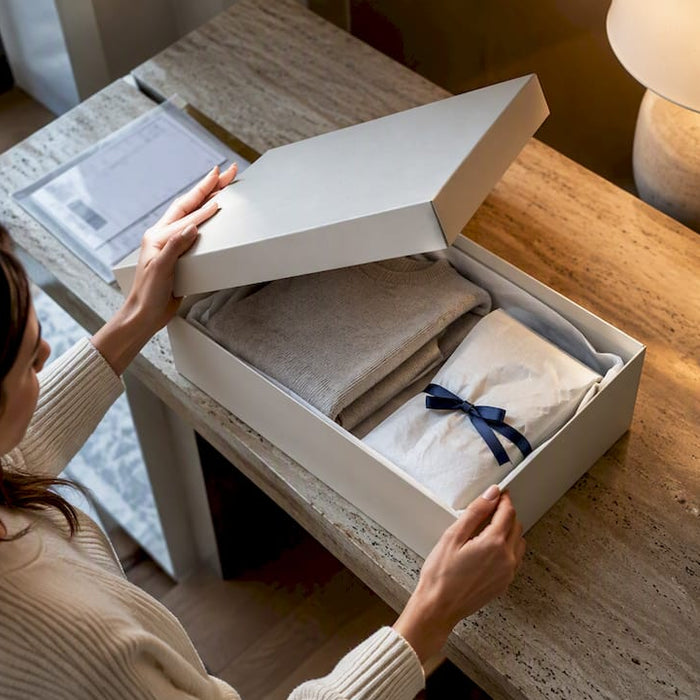 Shopper opening a European fashion parcel