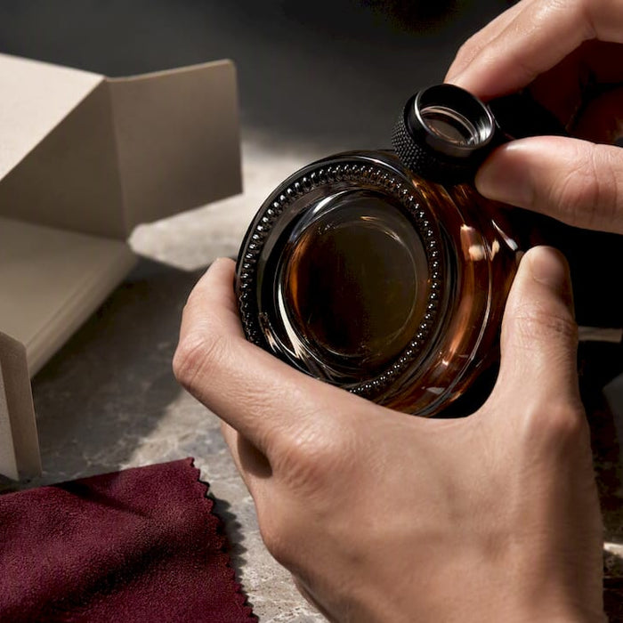 Inspecting production marks on fragrance packaging