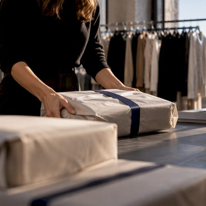 Anonymous fashion parcels in a Milan stockroom