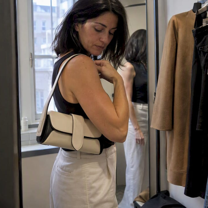 Collector checking the fit of a luxury handbag