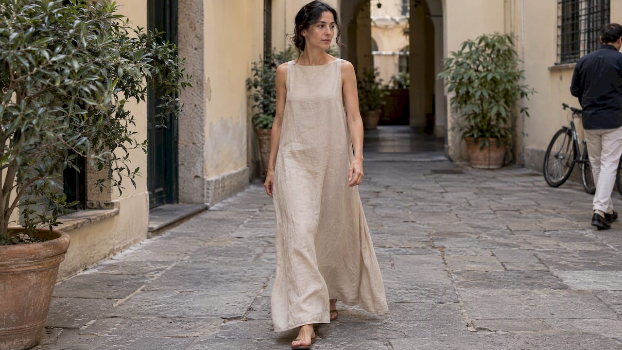 Woman wearing a beige Max Mara linen dress