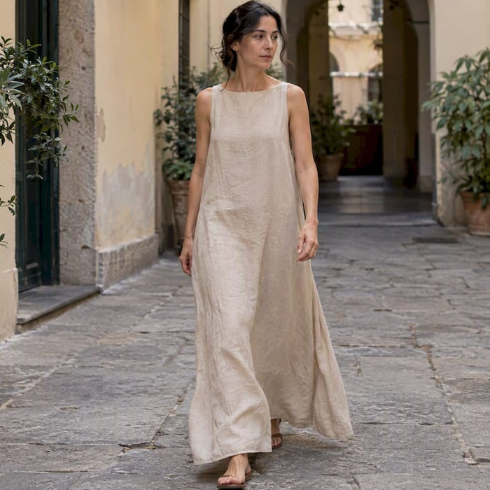 Woman wearing a beige Max Mara linen dress