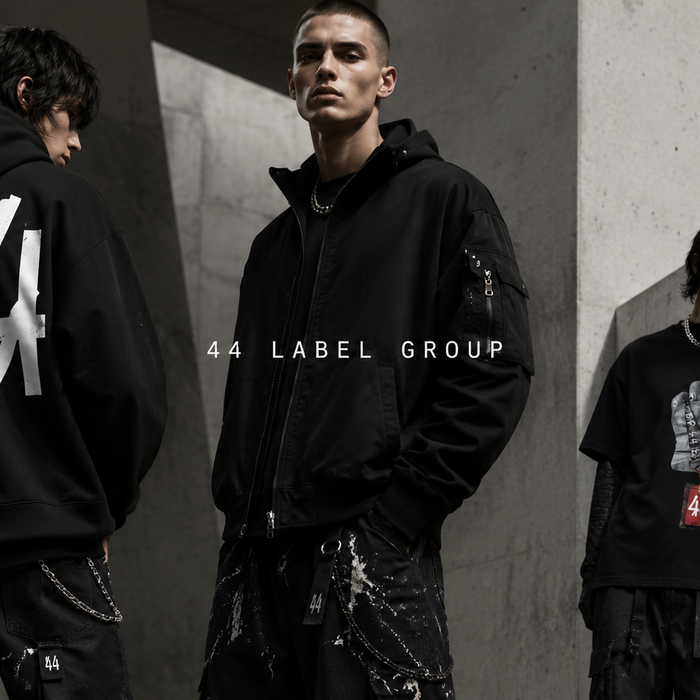 Stylish models showcasing 44 Label Group clothing in a contemporary urban setting, highlighting the brand's unique designs and streetwear aesthetics.