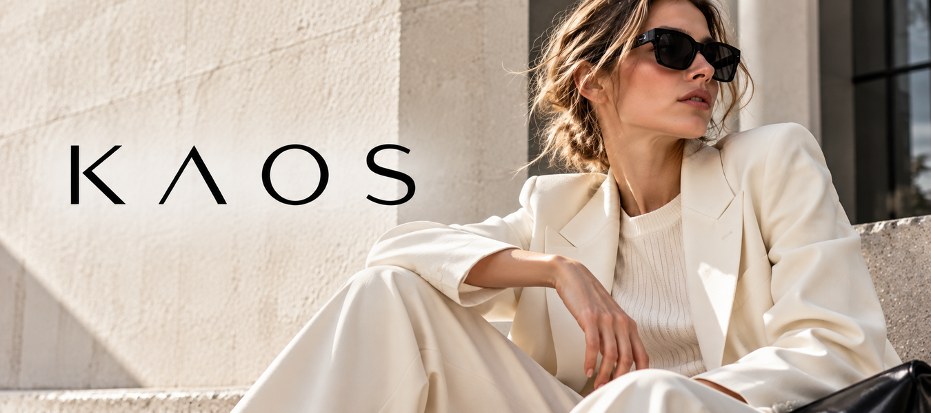 Kaos luxury fashion banner featuring a woman in a cream suit and sunglasses; Shop online luxury fashion Designer Kaos at Urbalenti.
