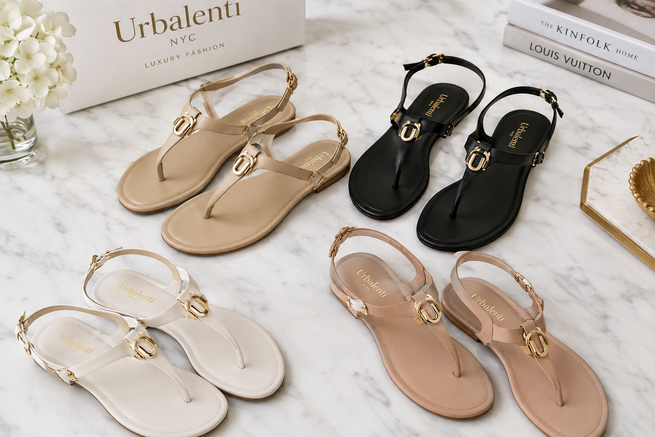 Designer Flip-Flop Sandals for Women in beige, black, white, and blush leather arranged on a marble surface; Shop Designer Flip-Flop Sandals for Women at urbalenti NYC.
