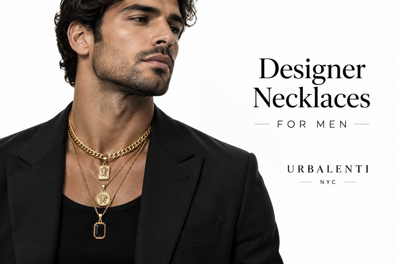 Male model wearing layered gold necklaces with a black blazer in a Designer Necklaces for Men collection campaign—Shop Designer Necklaces for Men at Urbalenti NYC.