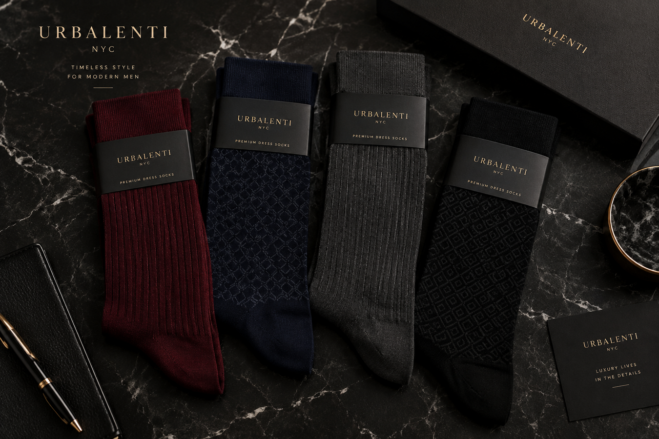 Designer Socks for Men by Urbalenti, featuring burgundy, navy, gray, and black luxury socks displayed on a marble surface with a premium gift box. Shop Designer Socks for Men at Urbalenti NYC.