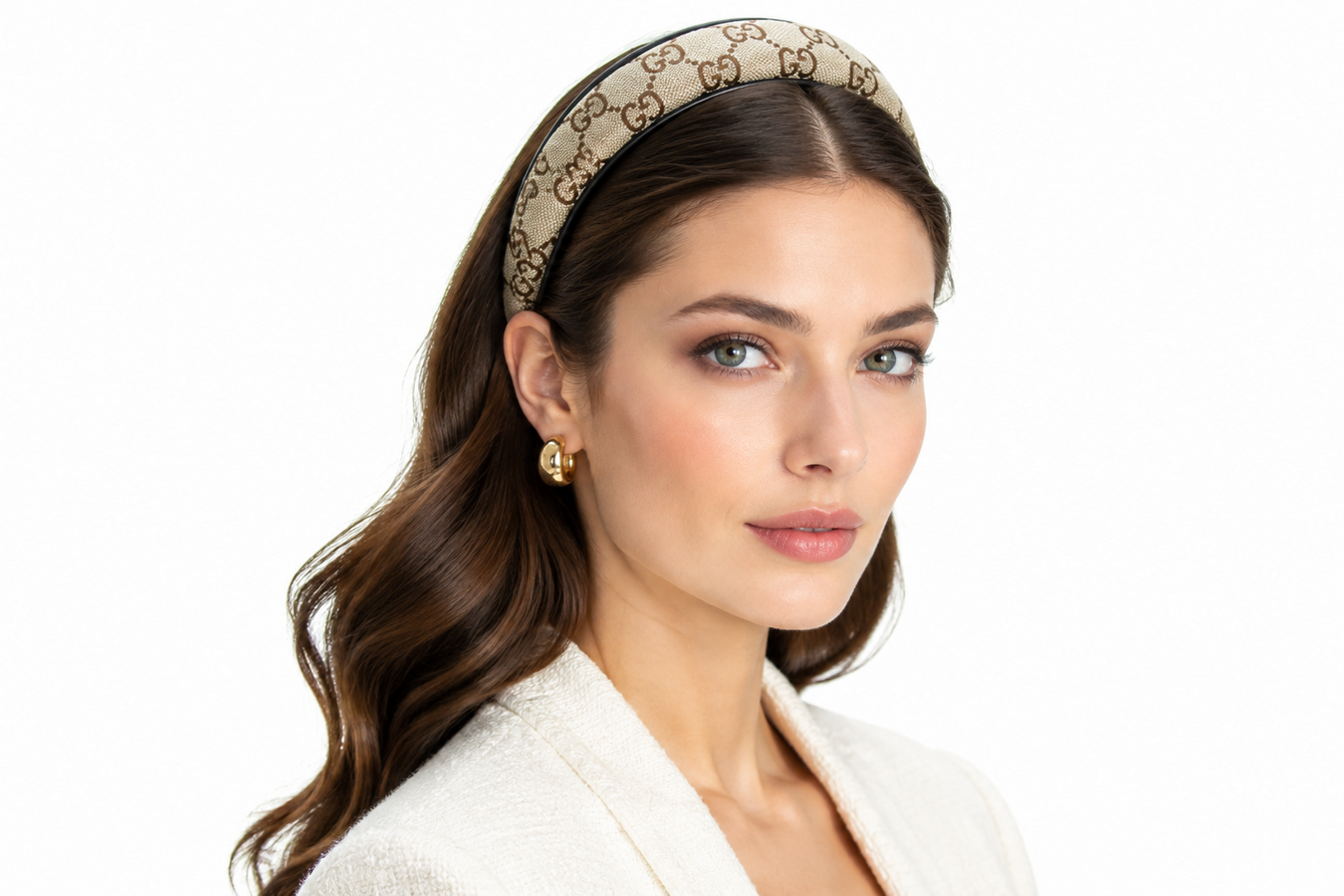 Woman wearing a luxurious monogram designer headband with a polished neutral outfit, showcasing Designer Headbands for Women—Shop Designer Headbands for Women at Urbalenti NYC.