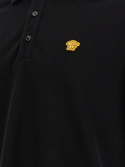 Detailed shot of the Medusa logo on the Versace Medusa Polo Shirt, accentuating its trendy appeal and high-quality finish, ideal for the Fall - Winter 2026/2027 lineup from Versace. A must-have for men's clothing. Men > Clothing > Shirts.