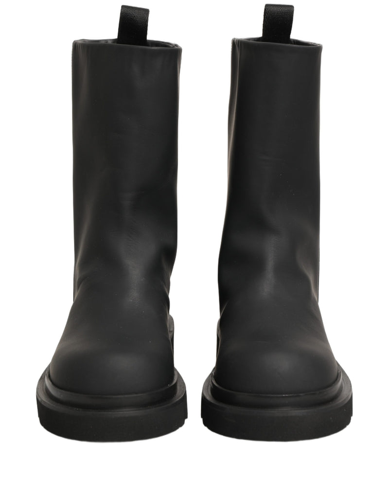 Botas para hombre de cuero negro y suela gruesa de Dolce & Gabbana, de media caña