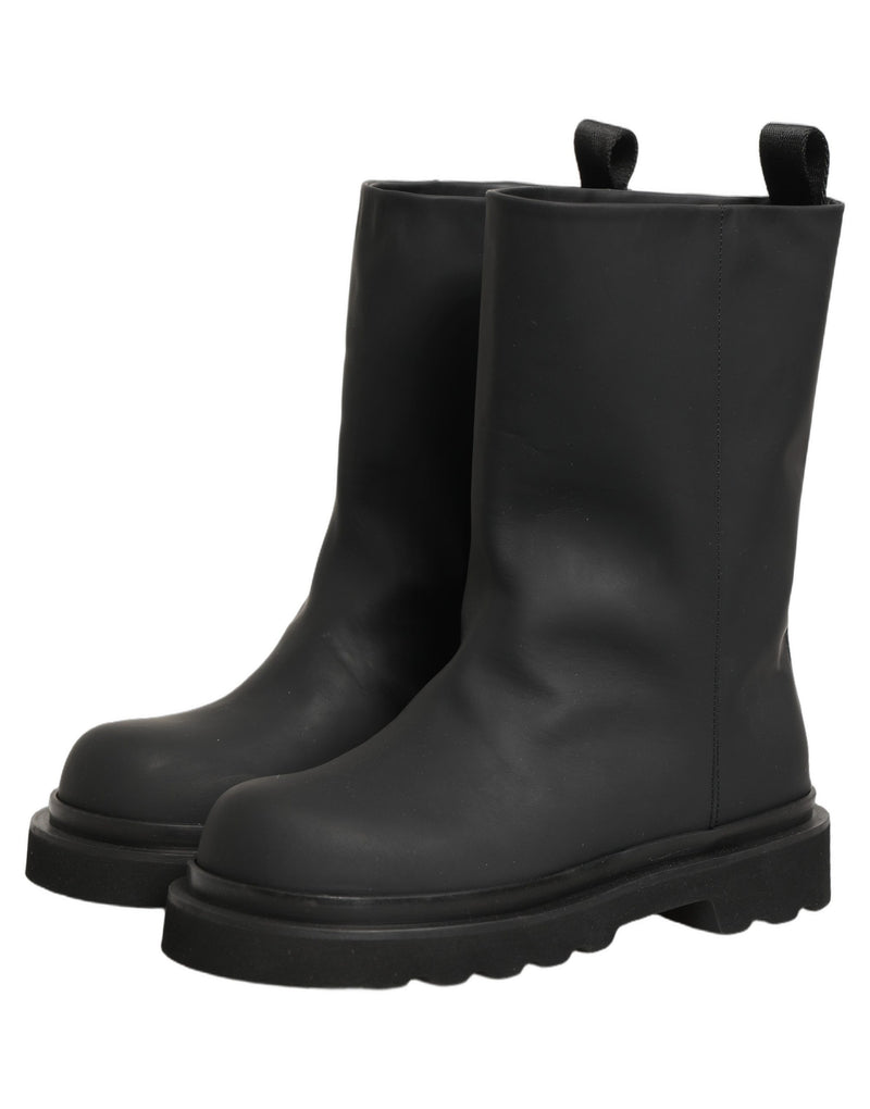 Botas para hombre de cuero negro y suela gruesa de Dolce & Gabbana, de media caña