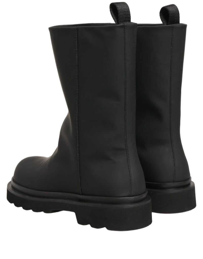 Botas para hombre de cuero negro y suela gruesa de Dolce & Gabbana, de media caña