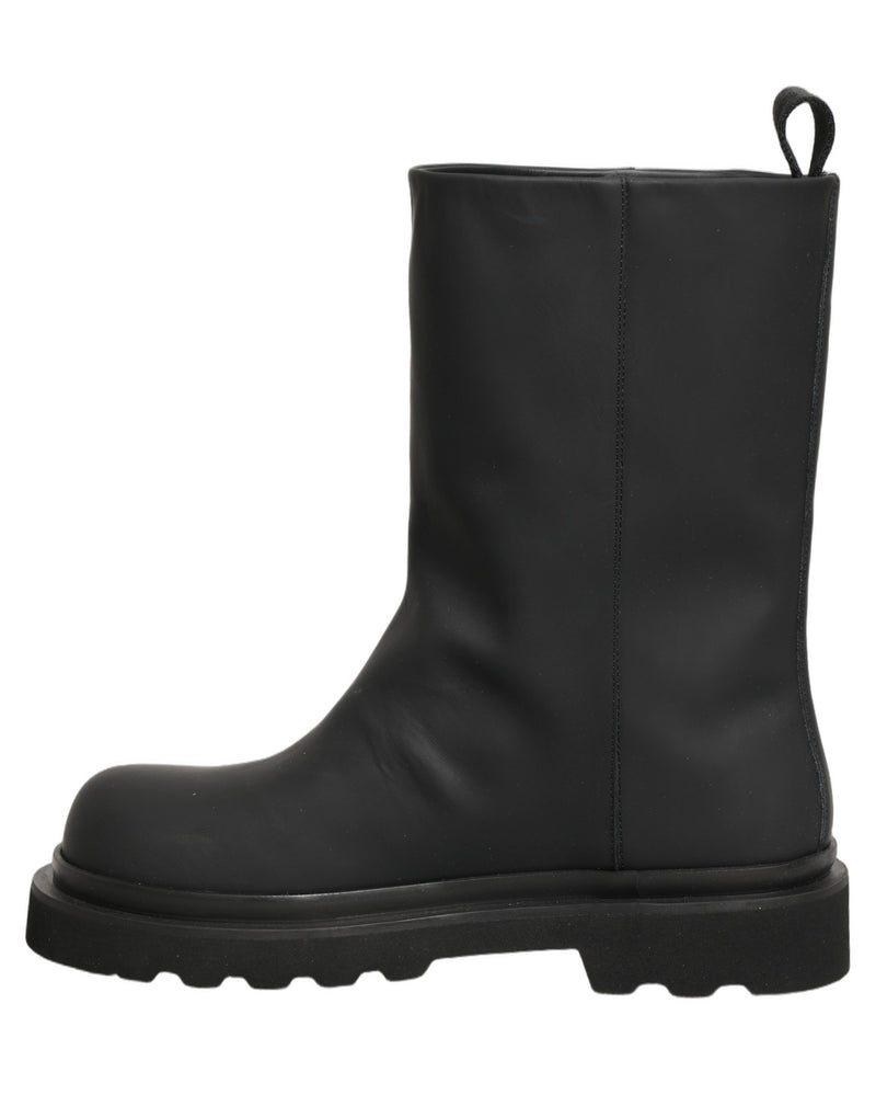 Botas para hombre de cuero negro y suela gruesa de Dolce & Gabbana, de media caña