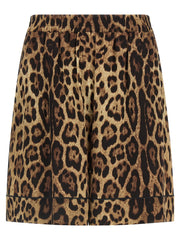 Dolce & Gabbana Leopard Print Silk Bermuda Shorts for Women, front view of brown leopard-print Bermuda shorts with black piping and elastic waistband. Dolce & Gabbana Silk Shorts for Women, Urbalenti NYC, 13879, 79680700467, Bermuda - Shorts - Clothing, Brown, Clothing, Discount_40-49, Dolce & Gabbana, in-stock, IT40, IT48, New with tags, Shorts - Clothing, Women.