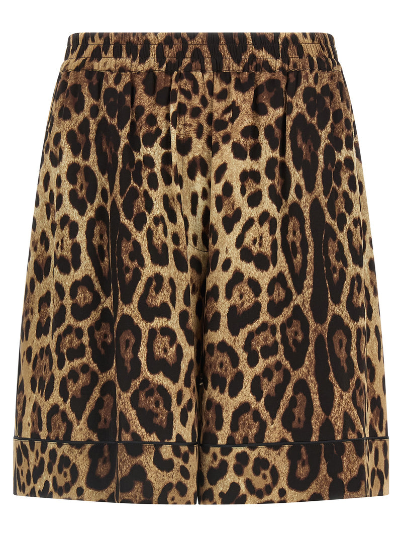 Dolce & Gabbana Leopard Print Silk Bermuda Shorts for Women, front view of brown leopard-print Bermuda shorts with black piping and elastic waistband. Dolce & Gabbana Silk Shorts for Women, Urbalenti NYC, 13879, 79680700467, Bermuda - Shorts - Clothing, Brown, Clothing, Discount_40-49, Dolce & Gabbana, in-stock, IT40, IT48, New with tags, Shorts - Clothing, Women.