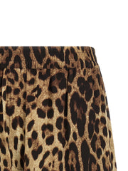 Close-up of the Dolce & Gabbana Leopard Print Silk Bermuda Shorts for Women showing the brown leopard-print silk fabric, gathered elastic waistband, and tailored side detail. Dolce & Gabbana Silk Shorts for Women, Urbalenti NYC, 13879, 79680700467, Bermuda - Shorts - Clothing, Brown, Clothing, Discount_40-49, Dolce & Gabbana, in-stock, IT40, IT48, New with tags, Shorts - Clothing, Women.