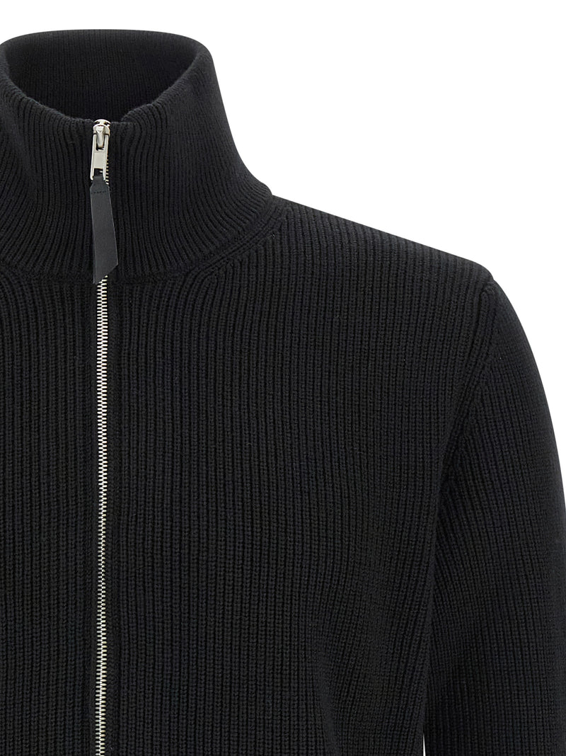 Maison Margiela Black Cotton Cardigan for mens | Black, close-up of the ribbed high funnel neckline and metal zipper with leather pull tab from Maison Margiela Cardigans.