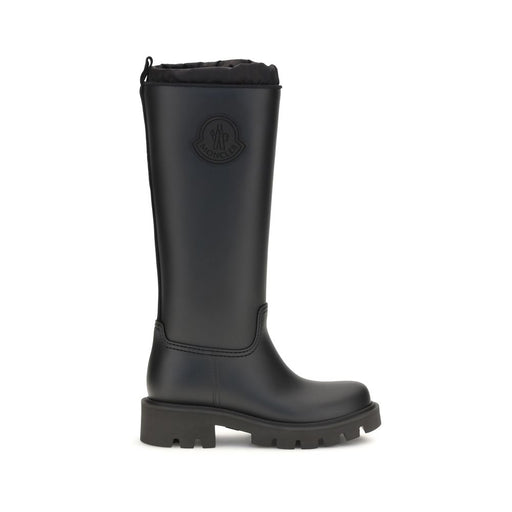 Moncler Black Waterproof Knee-High Rain Boots for Women, side view of black PVC Kickstream boots with round toe, rugged lug sole, and logo detail, available at Urbalenti NYC. Moncler Rain Boots for Women.