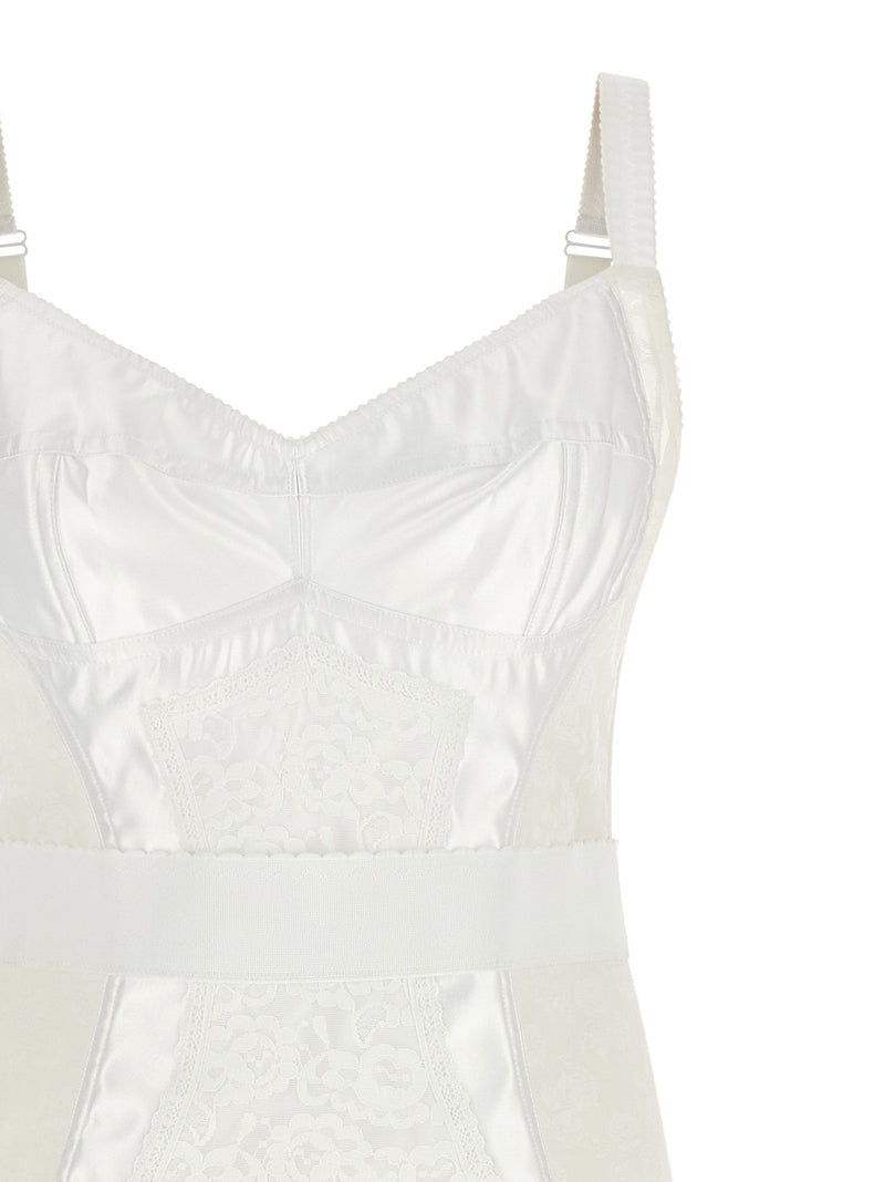 Close-up front detail of the Dolce & Gabbana White Polyamide Midi Dress | White, a Dolce & Gabbana Midi Dress with a sweetheart neckline, adjustable shoulder straps, satin panels, floral lace inserts, and structured corset bodice. A White Women’s Clothing style in Dresses - Clothing and Midi - Dresses - Clothing, size IT44, New with tags, in-stock, Discount_60-69, 13879, 79680700467.