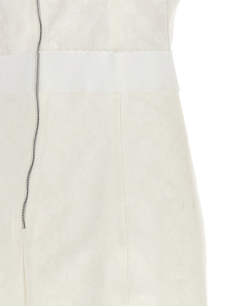 Close-up back detail of the Dolce & Gabbana White Polyamide Midi Dress | White, a Dolce & Gabbana Midi Dress highlighting the exposed back zip, textured lace-patterned polyamide fabric, and defined waist panel. This White Women’s Clothing design belongs to Dresses - Clothing and Midi - Dresses - Clothing; IT44, New with tags, in-stock, Discount_60-69, 13879, 79680700467.