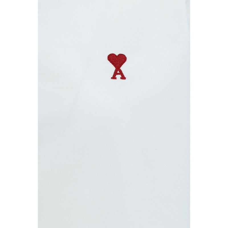 Ami Paris White Cotton Dress Shirt For Women With Logo Embroidery And Adjustable Cuffs, close-up of signature embroidered Ami de Cœur logo on the chest; Ami Paris White Cotton Dress Shirt