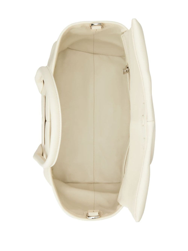 Interior view of the spacious Tod's Di Leather Tote Bag, emphasizing practical compartments for everyday use. This premium Italian leather bag is an essential for women, fitting into Women > Bags > Shopper for Spring - Summer 2024.