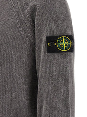 Close-up of the signature compass badge on the sleeve of the Stone Island Gray Cotton Cardigan for Men | Gray, showcasing distinctive Stone Island branding and premium gray cotton knit. This Stone Island Cardigan for Men is New with tags and in-stock in Gray, with sizes L, M, XL, and XXL; 13879, 79680700467, Cardigans - Sweaters - Clothing, Clothing, Discount_30-39, Men, Stone Island, Sweaters - Clothing.