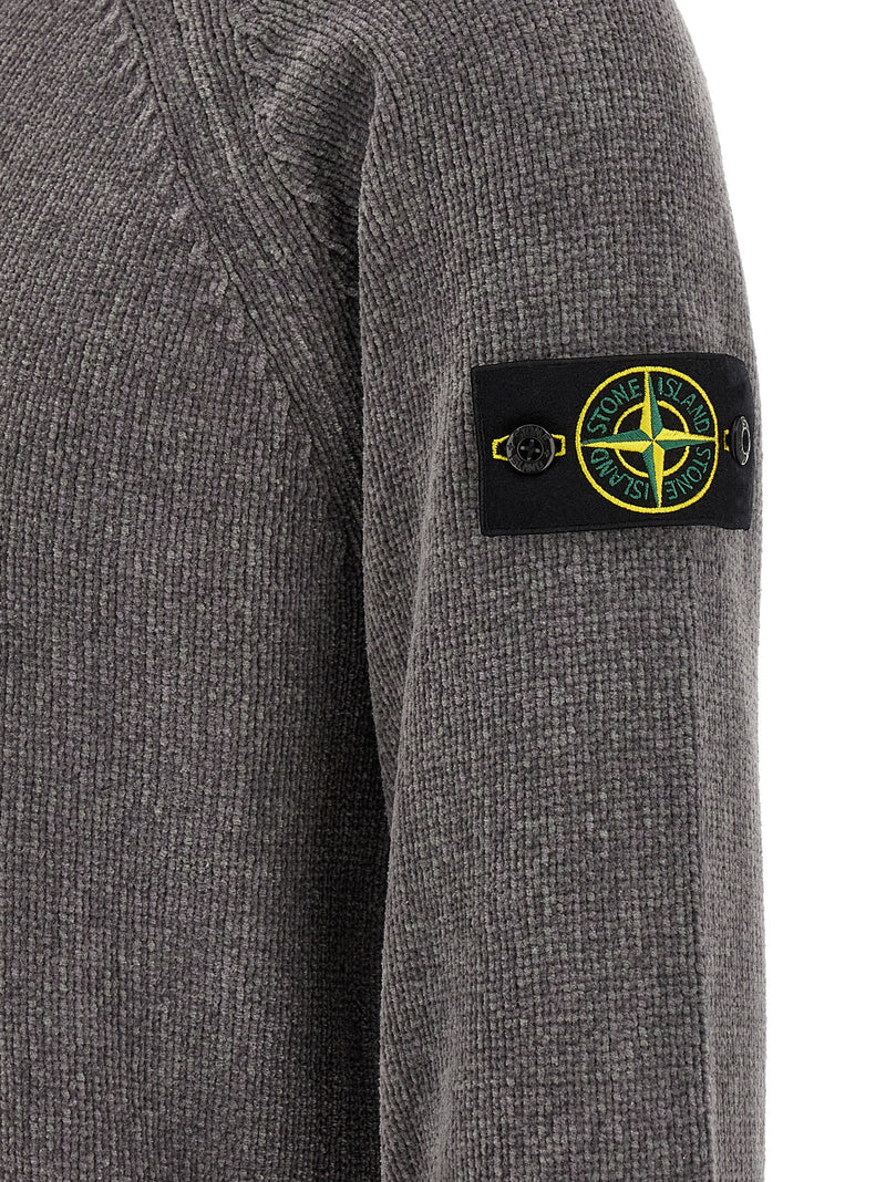 Close-up of the signature compass badge on the sleeve of the Stone Island Gray Cotton Cardigan for Men | Gray, showcasing distinctive Stone Island branding and premium gray cotton knit. This Stone Island Cardigan for Men is New with tags and in-stock in Gray, with sizes L, M, XL, and XXL; 13879, 79680700467, Cardigans - Sweaters - Clothing, Clothing, Discount_30-39, Men, Stone Island, Sweaters - Clothing.