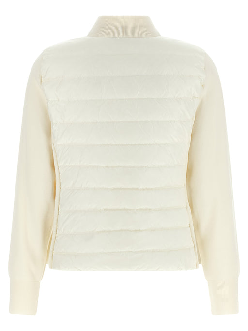 Back view of the Moncler White Nylon Hybrid Quilted Cardigan for Women, showcasing the padded quilted back and contrasting knit sleeves of this Moncler White Cardigan. Shop at Urbalenti NYC, product 13879, style 79680700467, listed under Cardigans - Sweaters - Clothing and Clothing, Discount_20-29, in-stock, sizes L, M, S and XS, Moncler, New with tags, White, Women, and Sweaters - Clothing.
