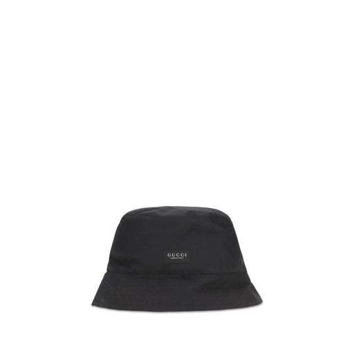 Front view of the Gucci Black Cotton Canvas Bucket Hat with Made in Italy Label, a stylish Gucci Bucket Hat in black with signature logo detail. Featured by Urbalenti NYC, style 13879 and 79661334579, this Accessories piece is listed under Black, Bucket Hats - Hats - Accessories, Discount_30-39, Gucci, Hats - Accessories, in-stock, L, M, Men, New with tags, and S.