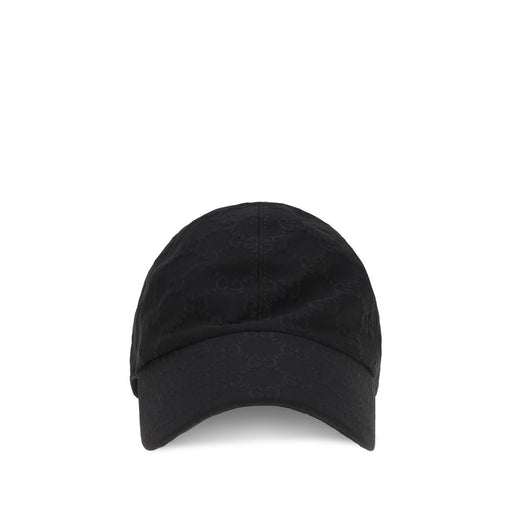 Front view of the Gucci Skylar Black Cotton Baseball Cap with GG Pattern, a Gucci Baseball Cap in black with an all-over tone-on-tone GG pattern and curved visor. Available at Urbalenti NYC, style 13879, product code 79661334579, in Accessories and Caps (Baseball Hat) - Hats - Accessories, with Discount_30-39 pricing; Gucci Hats - Accessories, in-stock, sizes L, M, and S, Women, New with tags.
