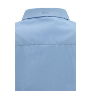 Close-up of the Prada logo collar on the Prada Cotton Poplin Shirt for Women in light blue cotton poplin. This refined Prada Shirt for Women is available at Urbalenti NYC, style 13879, 79661334579, Blue, Clothing, Discount_30-39, Dress Shirts - Shirts - Clothing, in-stock, IT38 | S, IT40 | M, New with tags, Prada, Shirts - Clothing, Women.