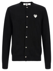 Comme Des Garçons Play Comme Des Garçons Play Black Wool Cardigan for Men, front view featuring the white heart logo, button closure, and ribbed trims. This Comme Des Garçons Cardigan for Men is Black and available as New with tags in size L for Men, listed under Cardigans - Sweaters - Clothing, Clothing, and Sweaters - Clothing; in-stock, Discount_30-39, 13879, 79680700467.