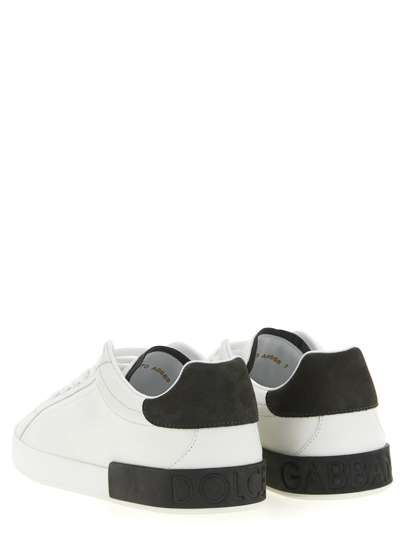 Dolce & Gabbana White Calfskin Low Top Sneakers for Men, rear view showing the dark gray heel inserts and embossed Dolce & Gabbana branding on the soles. These white Dolce & Gabbana Sneakers for Men are available at Urbalenti NYC, 13879, 79680700467, Discount_40-49, Dolce & Gabbana, EU 40 | US 7, EU 41 | US 8, EU 42 | US 9, EU43/US10, EU44/US11, EU45/US12, EU46/US13, EU47/US14, in-stock, Low Tops - Sneakers - Shoes, Men, New with tags, Shoes, Sneakers - Shoes, White.
