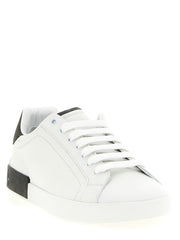 Dolce & Gabbana White Calfskin Low Top Sneakers for Men, angled front view highlighting the supple white calfskin leather, classic lace-up design, and flat sole. Stylish Dolce & Gabbana Sneakers for Men from Urbalenti NYC, 13879, 79680700467, Discount_40-49, Dolce & Gabbana, EU 40 | US 7, EU 41 | US 8, EU 42 | US 9, EU43/US10, EU44/US11, EU45/US12, EU46/US13, EU47/US14, in-stock, Low Tops - Sneakers - Shoes, Men, New with tags, Shoes, Sneakers - Shoes, White.