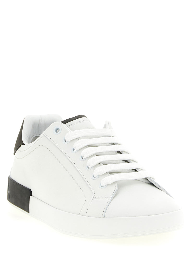 Dolce & Gabbana White Calfskin Low Top Sneakers for Men, angled front view highlighting the supple white calfskin leather, classic lace-up design, and flat sole. Stylish Dolce & Gabbana Sneakers for Men from Urbalenti NYC, 13879, 79680700467, Discount_40-49, Dolce & Gabbana, EU 40 | US 7, EU 41 | US 8, EU 42 | US 9, EU43/US10, EU44/US11, EU45/US12, EU46/US13, EU47/US14, in-stock, Low Tops - Sneakers - Shoes, Men, New with tags, Shoes, Sneakers - Shoes, White.