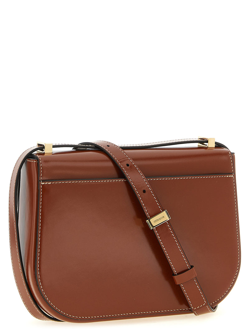 Rear view of the Ferragamo Double Gancini Leather Crossbody Bag for Women in smooth brown leather, showing the adjustable strap and structured design; an elegant Ferragamo Crossbody Bag for Women from Urbalenti NYC, 13879, 79680700467, Bags, Brown, Crossbody Bags - Bags, Discount_40-49, Ferragamo, in-stock, New with tags, Women.