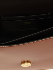 Interior view of the Ferragamo Double Gancini Leather Crossbody Bag for Women showing the lined compartment, slit pocket, Ferragamo Made in Italy branding, and gold-tone closure; a brown Ferragamo Crossbody Bag for Women from Urbalenti NYC, 13879, 79680700467, Bags, Brown, Crossbody Bags - Bags, Discount_40-49, Ferragamo, in-stock, New with tags, Women.