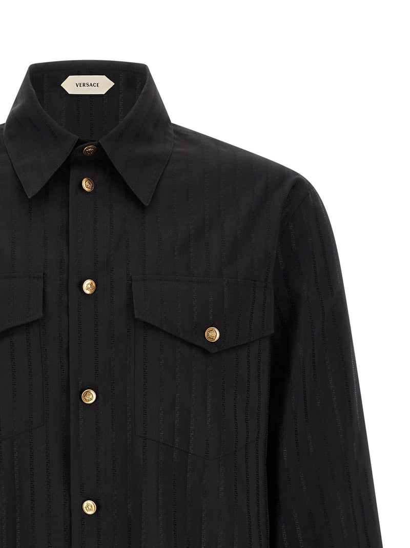 Close-up of the Versace Black Cotton Silk Jacquard Shirt for Men with Medusa Buttons, highlighting the pointed collar, chest pocket, tonal jacquard pattern, and gold-tone Medusa buttons on this Versace Shirt for Men. Urbalenti NYC, 13879, 48 | M, 79680700467, Black, Blouses - Shirts - Clothing, Clothing, Discount_40-49, in-stock, IT50 | L, IT52 | XL, Men, New with tags, Shirts - Clothing, Versace, XXL.