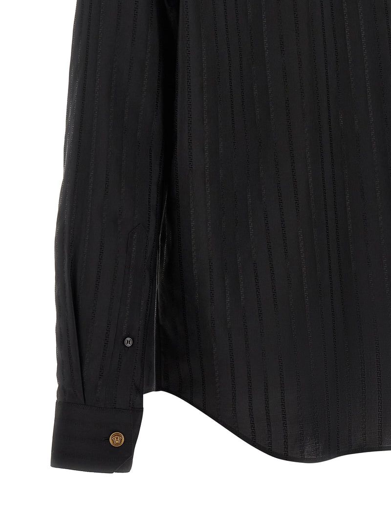 Close-up detail of the sleeve and curved hem on the Versace Black Cotton Silk Jacquard Shirt for Men with Medusa Buttons, showcasing the black cotton silk texture and gold-tone cuff button of this Versace Shirt for Men. Urbalenti NYC, 13879, 48 | M, 79680700467, Black, Blouses - Shirts - Clothing, Clothing, Discount_40-49, in-stock, IT50 | L, IT52 | XL, Men, New with tags, Shirts - Clothing, Versace, XXL.