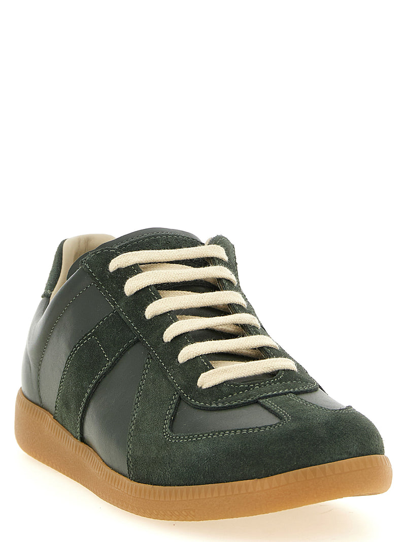 Maison Margiela Replica Bicolor Calfskin Low Top Sneakers shown from the front three-quarter view in forest green calfskin and suede with contrasting cream laces and honey-toned sole. Maison Margiela Replica Sneakers for Men from Urbalenti NYC, style 13879, product code 79680700467, Bicolor, Discount_30-39, EU 40 | US 7, EU 41 | US 8, EU43/US10, in-stock, Low Tops - Sneakers - Shoes, Maison Margiela, Men, New with tags, Shoes, Sneakers - Shoes.
