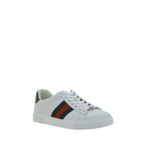 Gucci White Calf Leather Low Top Sneakers for Men | Side Bands, shown in a front three-quarter view with lace-up fastening, round toe, white calf leather, contrasting green and red side bands, and rubber sole. These Gucci White Leather Sneakers for Men are from Urbalenti NYC, style 13879, item 79661334579, Discount_30-39, available in EU 38 | US 5, EU39.5/US6.5, EU39/US6, and EU42.5/US9.5. Gucci, in-stock, Low Tops - Sneakers - Shoes, Men, New with tags, Shoes, Sneakers - Shoes, White.