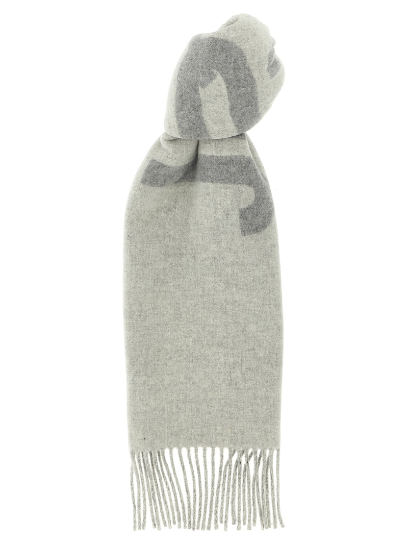 Jacquemus Wool Scarf, Jacquemus Gray Virgin Wool Scarf with Intarsia Logo and Fringes, shown in full with gray intarsia logo and fringed edges at Urbalenti NYC