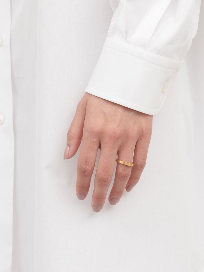 Maison Margiela logo-engraved band ring | Urbalenti™ NYC