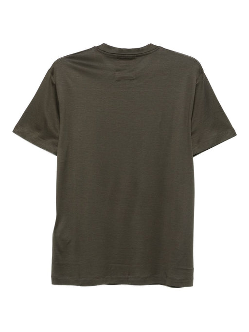 Back view of an Emporio Armani T-Shirt in green, highlighting the minimalist design and quality fabric. Ideal for layering or wearing solo, this best seller from the Fall - Winter 2025 collection offers comfort and sophistication. Discover more from Emporio Armani T-Shirts, designed for men who value style and elegance in their clothing essentials.