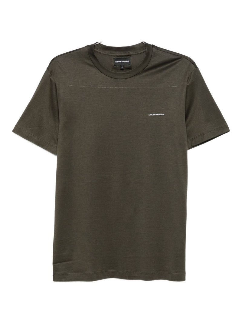 Front view of an Emporio Armani T-Shirt in green, showcasing the brand's signature style. Perfect for casual and smart-casual outfits, this best seller is part of the Fall - Winter 2025 collection. Shop now for stylish men's clothing from Emporio Armani T-Shirts. It’s a must-have for men who appreciate premium quality. Enjoy versatile topwear options that elevate any wardrobe.