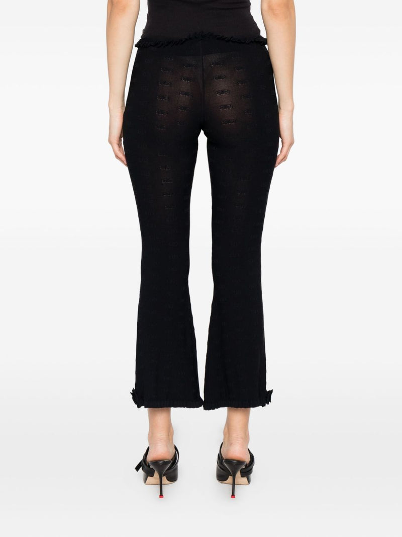 Pantalones acampanados Balenciaga con volantes | URBALENTI™